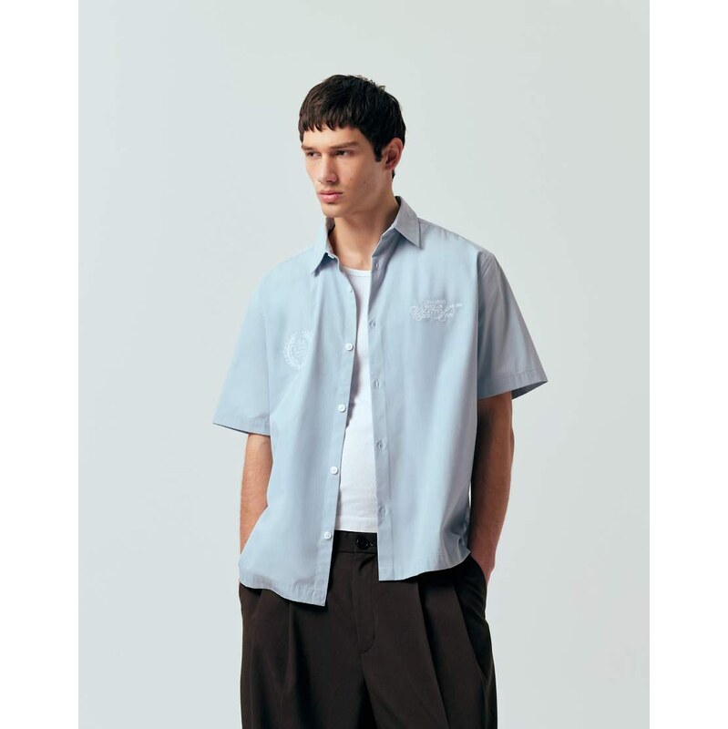 ASOS DESIGN relaxed shirt with chest embroidery in light blue