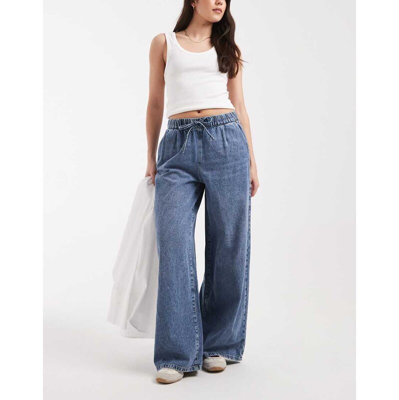 Vero Moda Valeria mid rise wide leg pull on jeans in medium blue wash 115518323