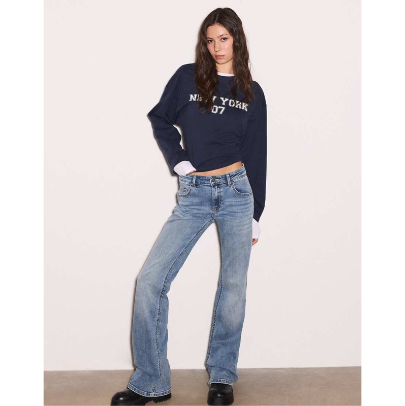 Stradivarius Low-rise bell bottom jeans in medium blue denim