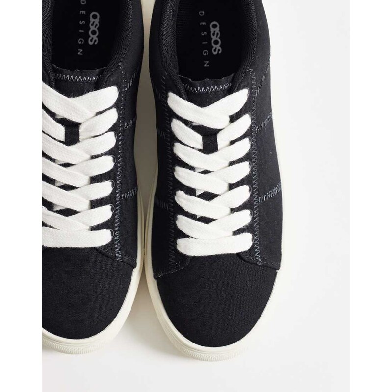 ASOS DESIGN lace up canvas trainer in black with stitch detail