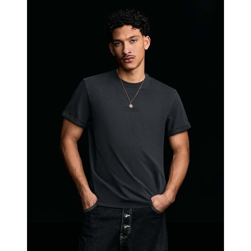Bershka Short sleeve roll up print t-shirt in black