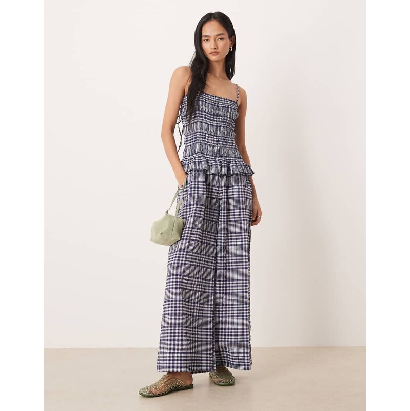 ASOS DESIGN shirred peplum jumpsuit in navy gingham 113436332