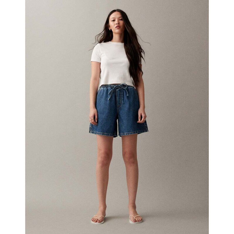 ASOS DESIGN denim pull on longerline short in mid blue
