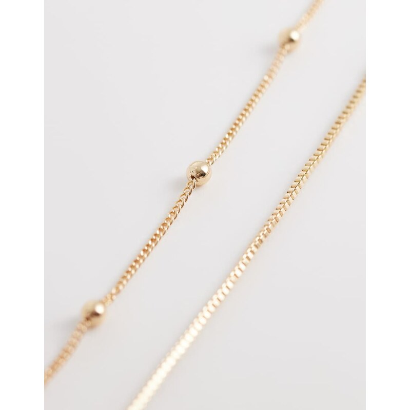 ASOS DESIGN multi-row belly chain with dot-dash detail in gold tone 113465086