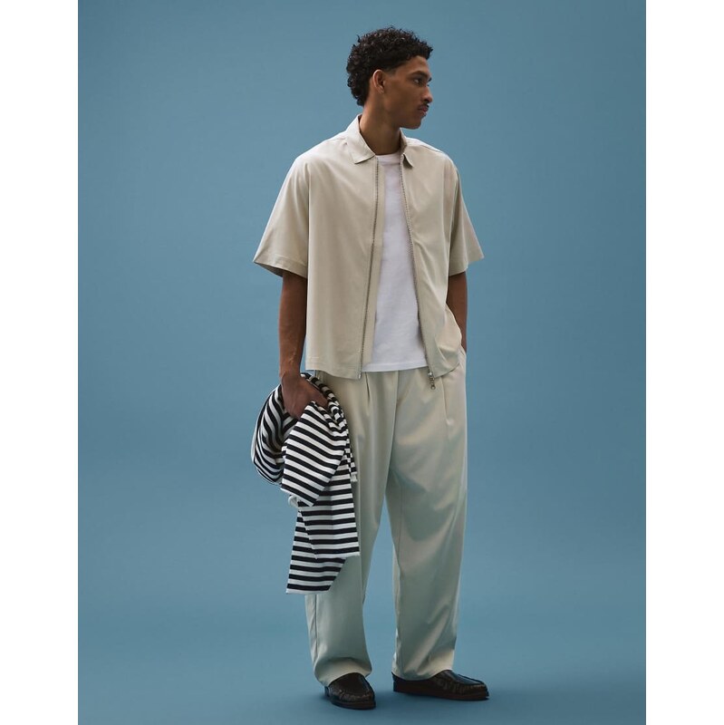 Bershka Fluid super baggy darted trousers in sand-Neutral