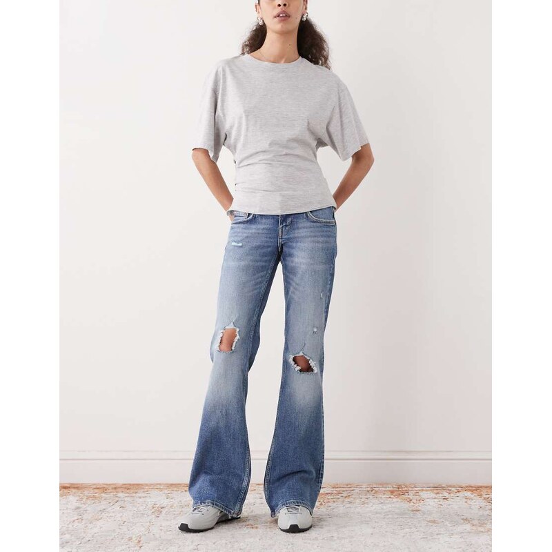 Weekday distressed bootcut flared jeans in mid blue