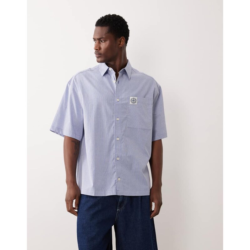 ASOS DESIGN oversized stripe shirt with chest badge in blue
