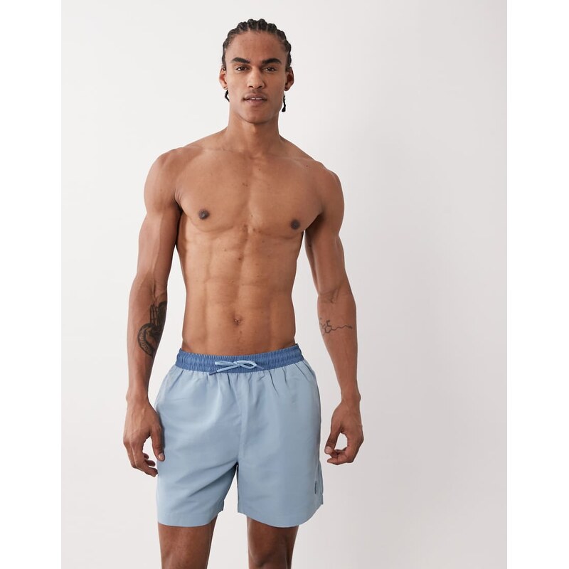 River Island rubber badge detail swim shorts in light blue