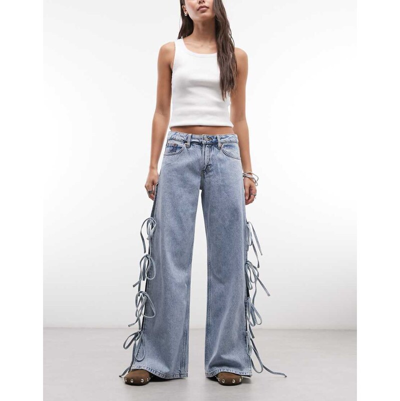 Monki low waist wide leg jeans with side tie bow detail in blue wash 114263751