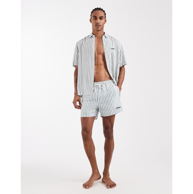ASOS DESIGN swim shorts in short length with green stripe and