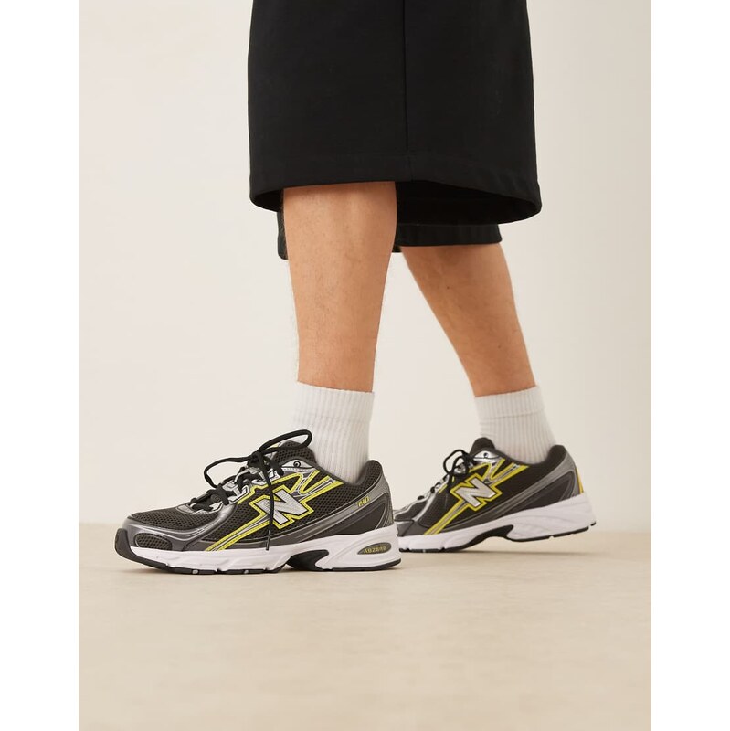 New Balance 740 trainers in black and yellow