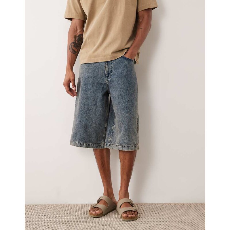 ASOS DESIGN longer length denim jorts in mid wash blue with tint