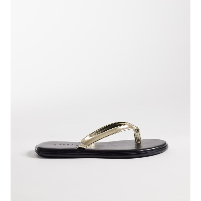 SEQWL Wide Fit jelly flip flops in black with gold strap 113297231