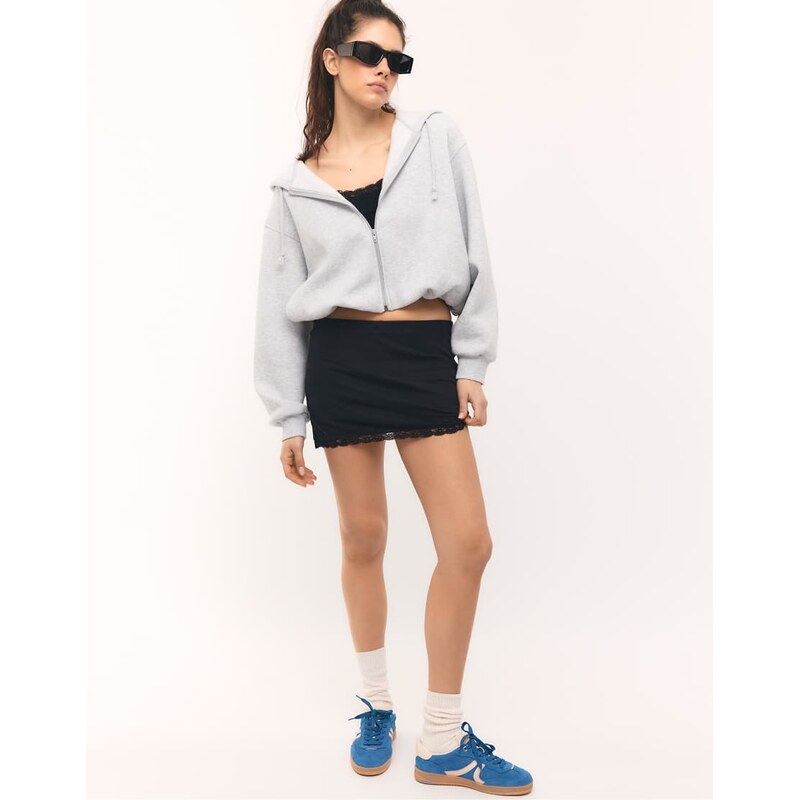 Stradivarius Lace trim mini skort in black 114561582