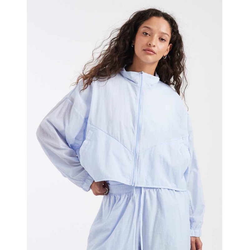 Nike funnel neck cropped windrunner jacket in light blue