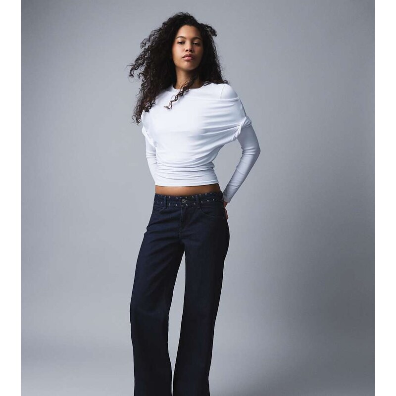 Bershka Petite low-rise studded baggy jeans in blue-Navy