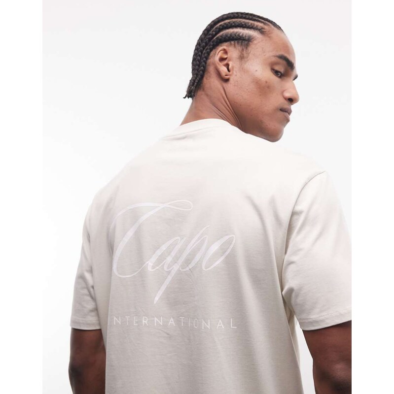 CAPO international logo back print t-shirt in beige-Neutral