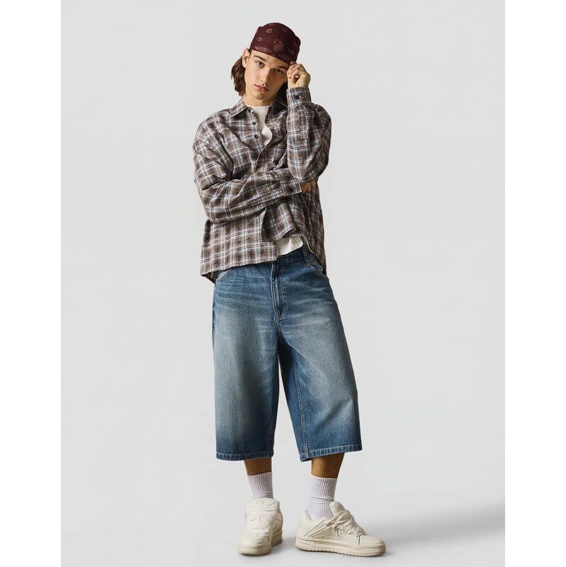 Bershka Super baggy denim bermuda shorts in mid blue