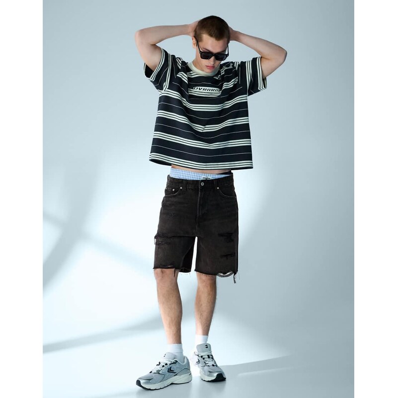 Bershka Ripped denim bermuda shorts in black