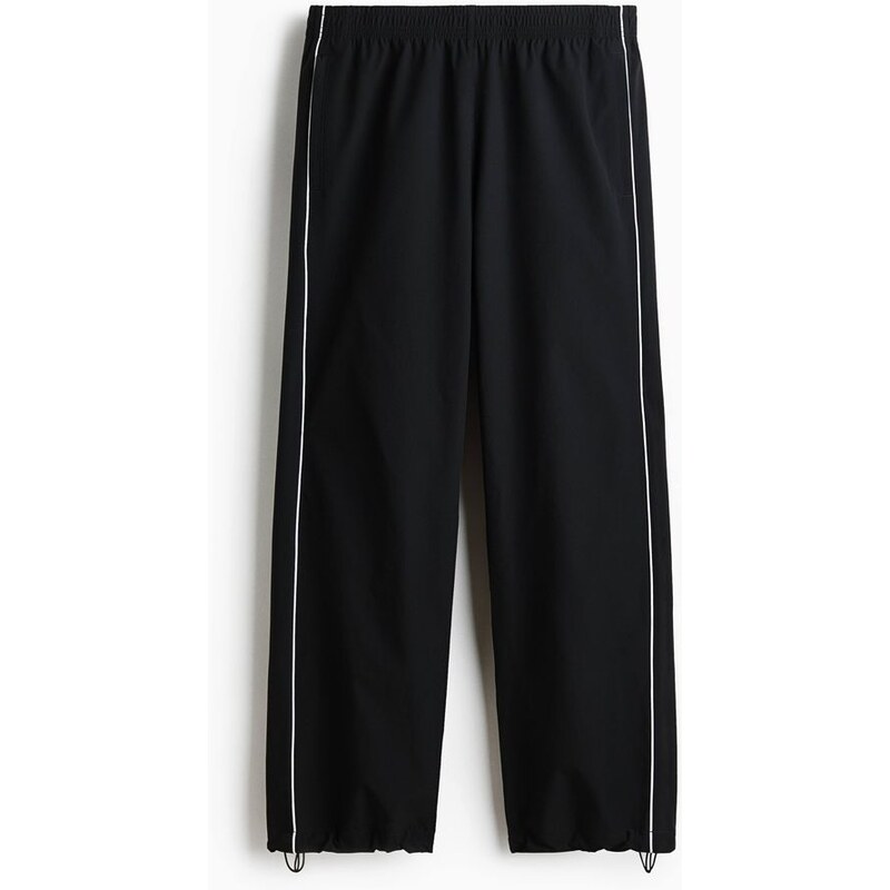 H&M - Sportovní kalhotys potiskem Relaxed Fit - Černá/Honda