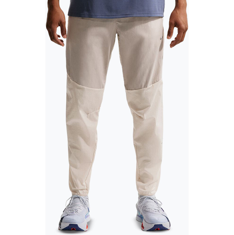 Pánské běžecké kalhoty Nike Stride Repel Woven cream li/birch