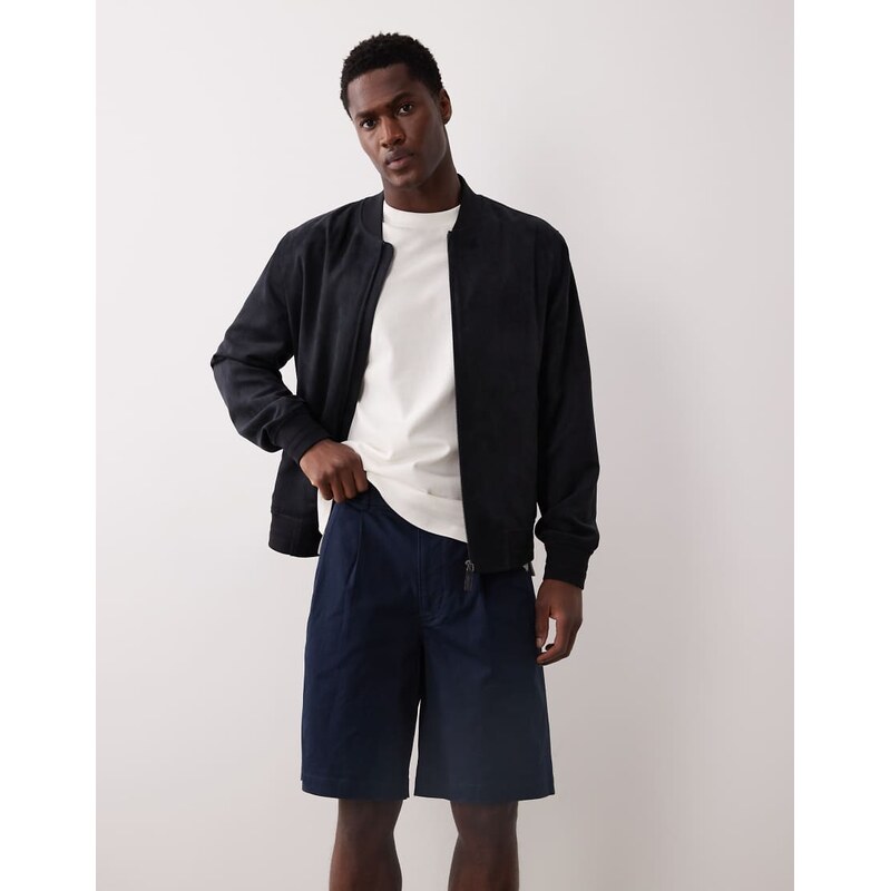 Calvin Klein Jeans 9 pleated chino shorts in navy