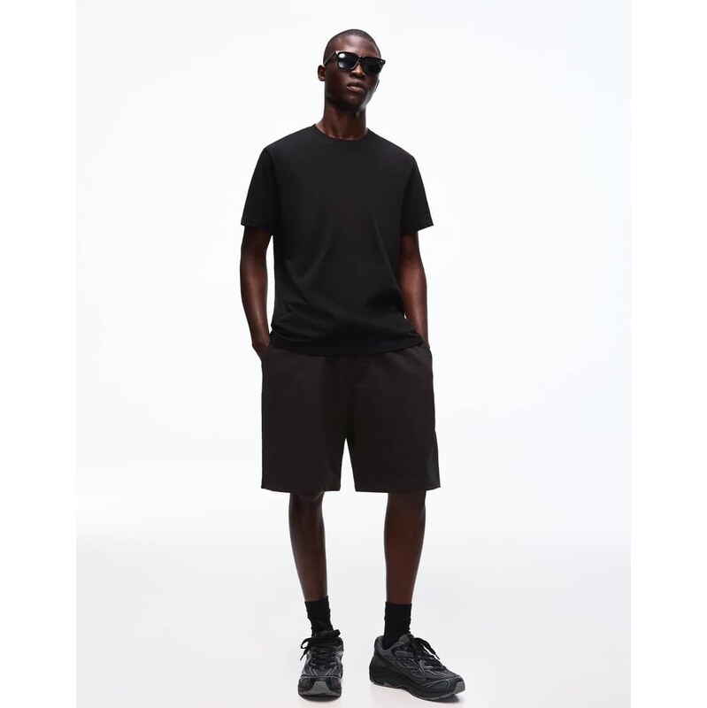 Bershka Coordinated t-shirt and shorts set in black-Neutral