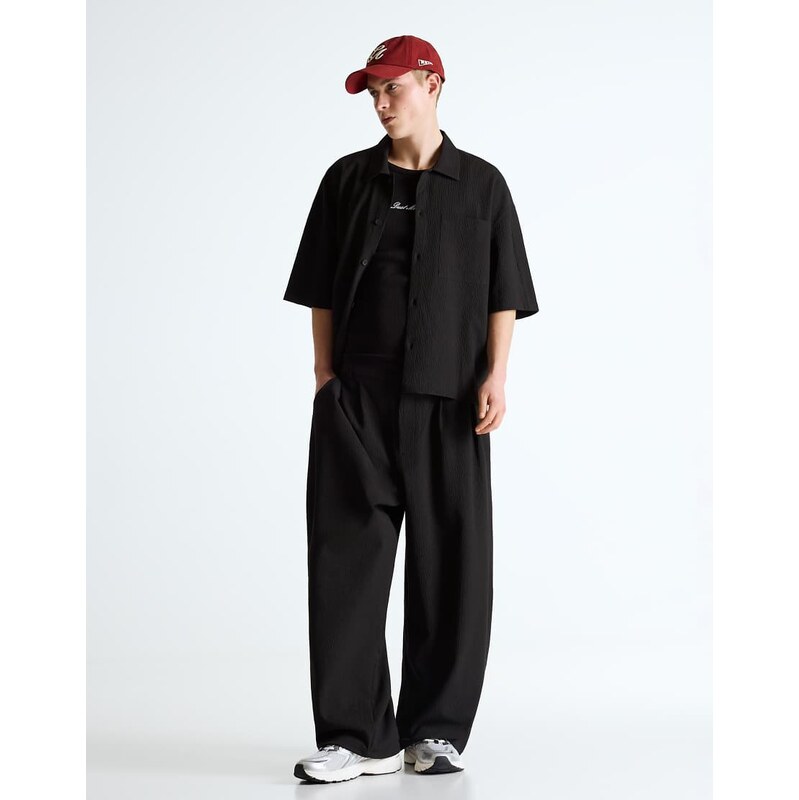 Bershka Pleated semi-jogger super baggy trousers in black