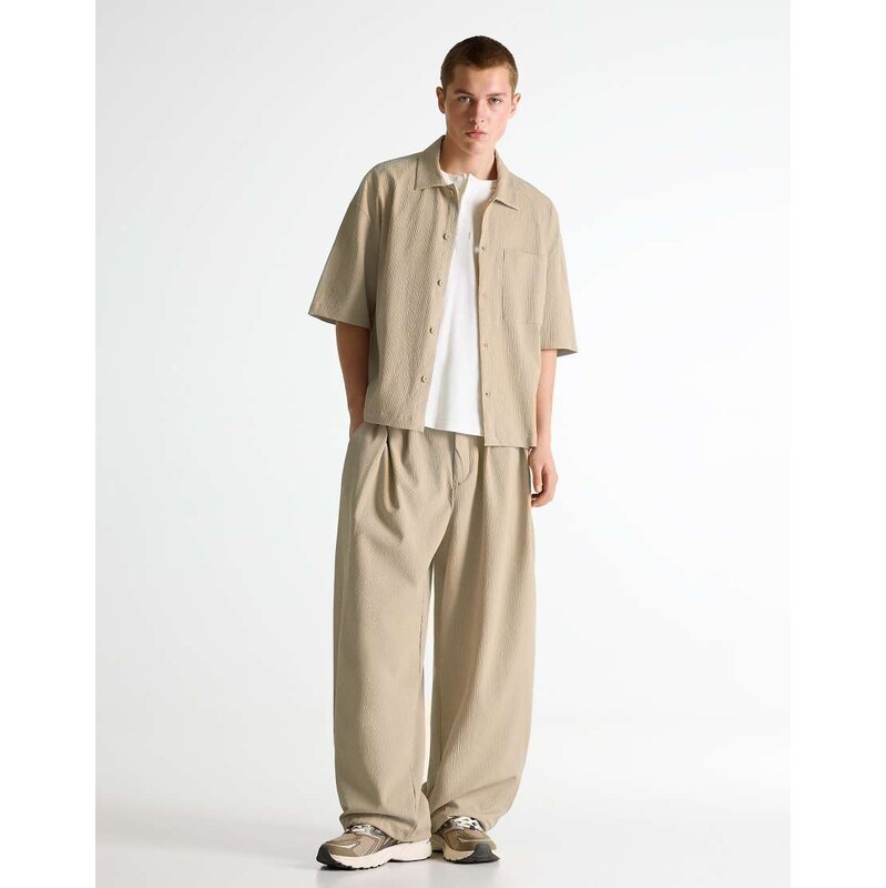 Bershka Pleated semi-jogger super baggy trousers in beige