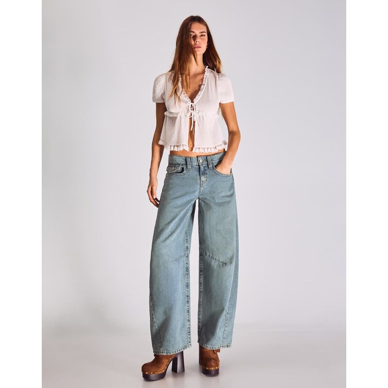 Bershka Low-rise slouchy jeans in mid blue