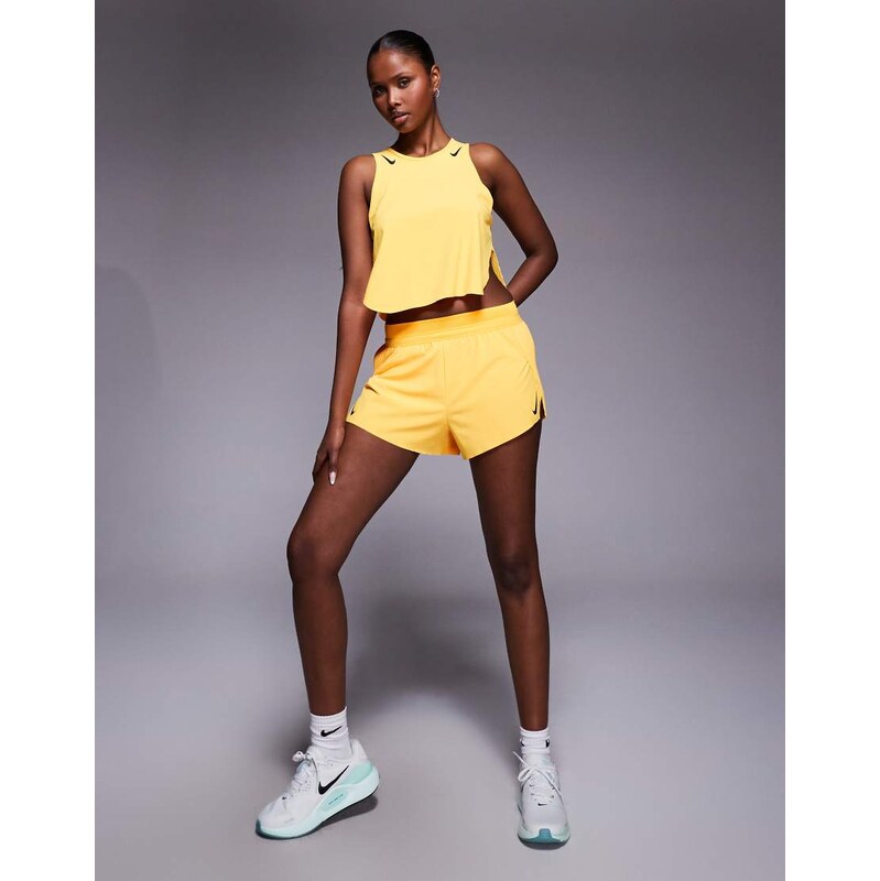 Nike Running Aeroswift Dri-FIT plisse mid rise shorts in yellow
