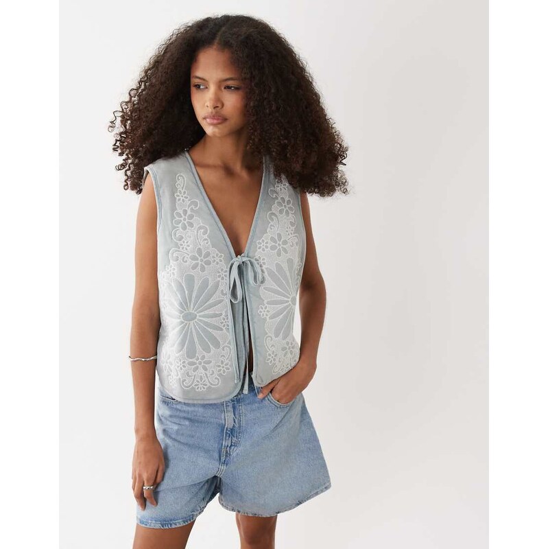 ASOS DESIGN quilted waistcoat with intricate floral mesh design