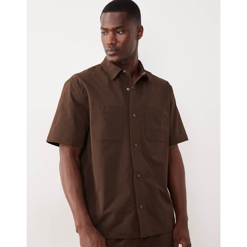 ASOS DESIGN motionMAX relaxed shirt with chest pockets in brown