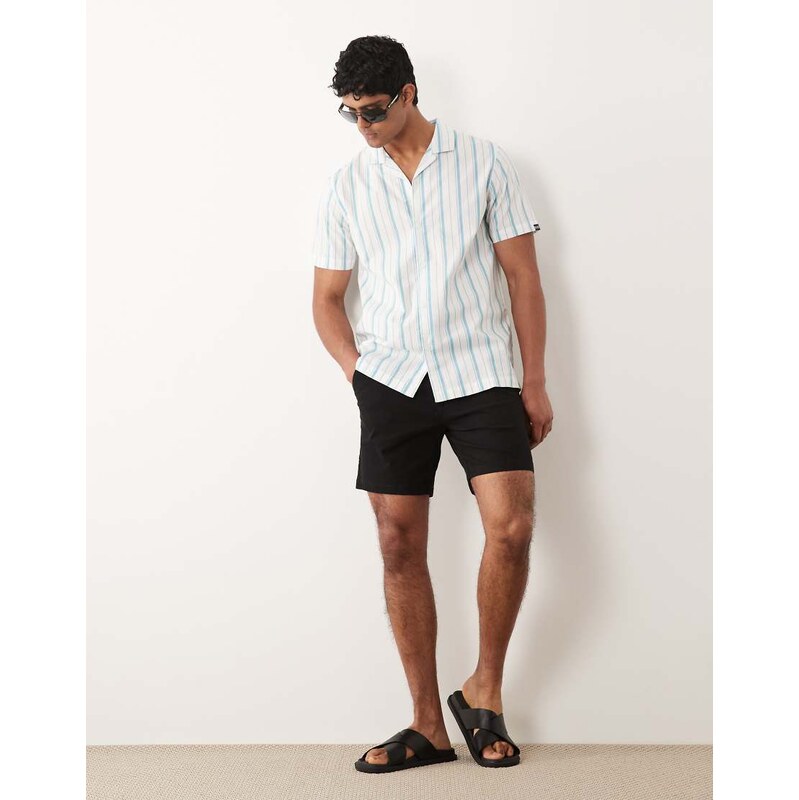 ASOS DESIGN slim fit chino shorts in mid length in black
