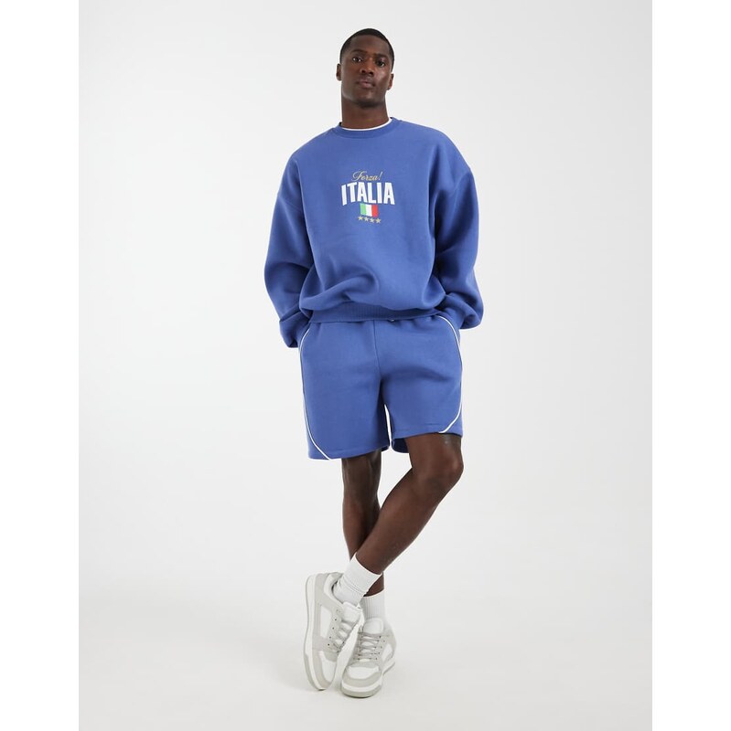 ASOS DESIGN loose sports jersey shorts with piping in blue