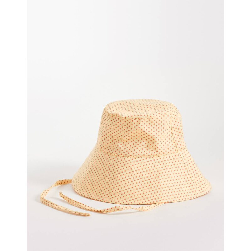 Reclaimed Vintage bucket hat with ties in yellow and red polka dot 115071049