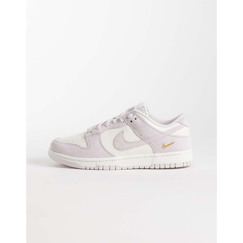 Nike Dunk Low trainers in white and pink