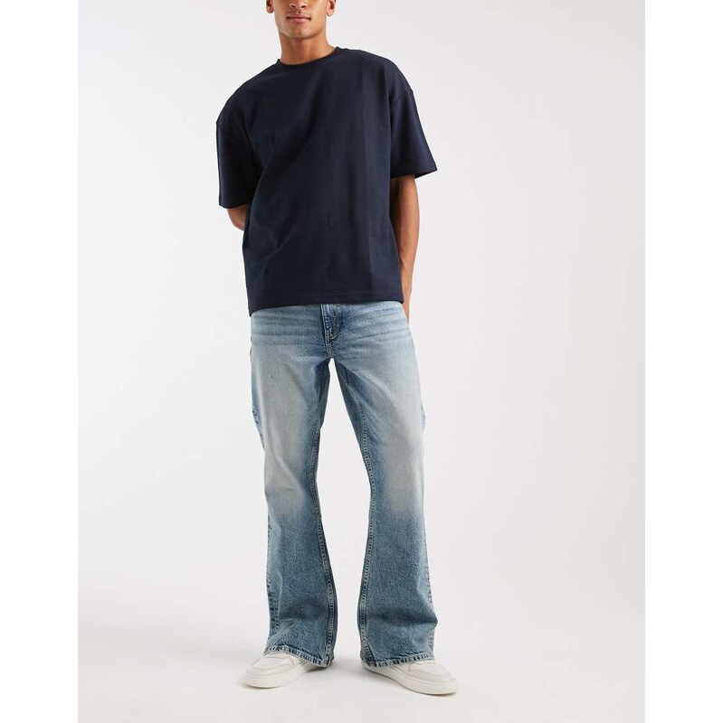 ASOS DESIGN flared jeans in light wash blue