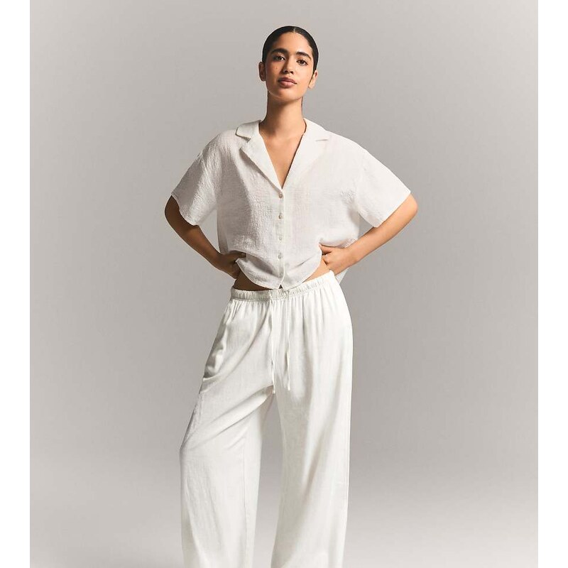 Bershka Petite linen blend trousers with an elasticated