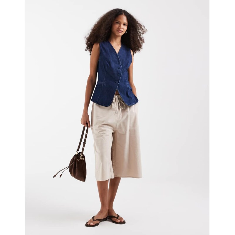 Vero Moda denim asymmetric placket waistcoat with covered buttons in medium blue wash