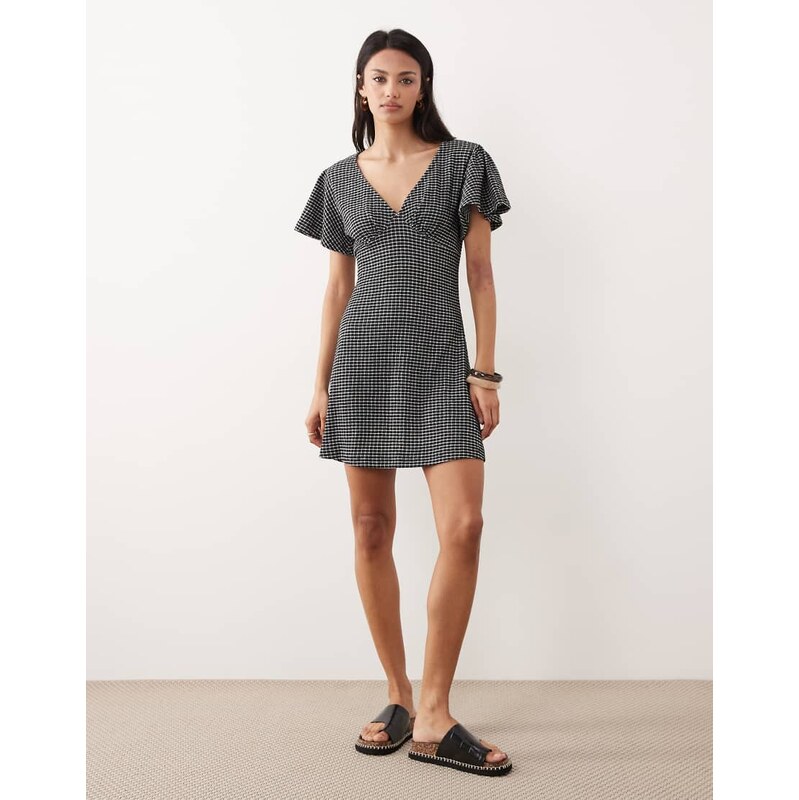 ASOS DESIGN v neck floaty mini dress in black gingham texture