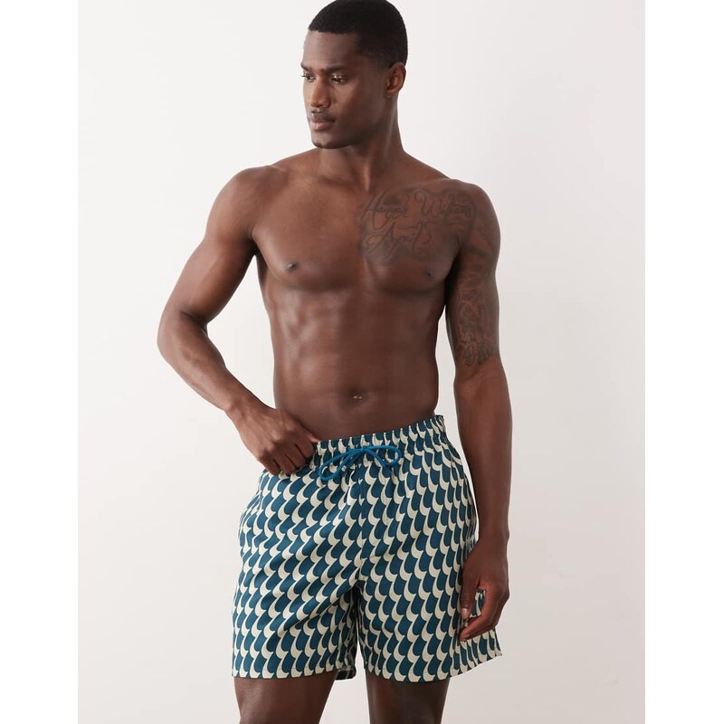 ASOS DESIGN swim shorts in mid length in wavey blue print