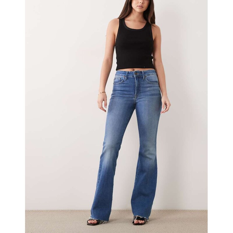 Good American good legs flare jeans in mid blue wash