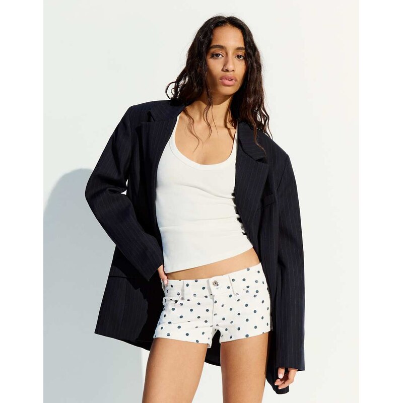Bershka Polka dot denim shorts in white