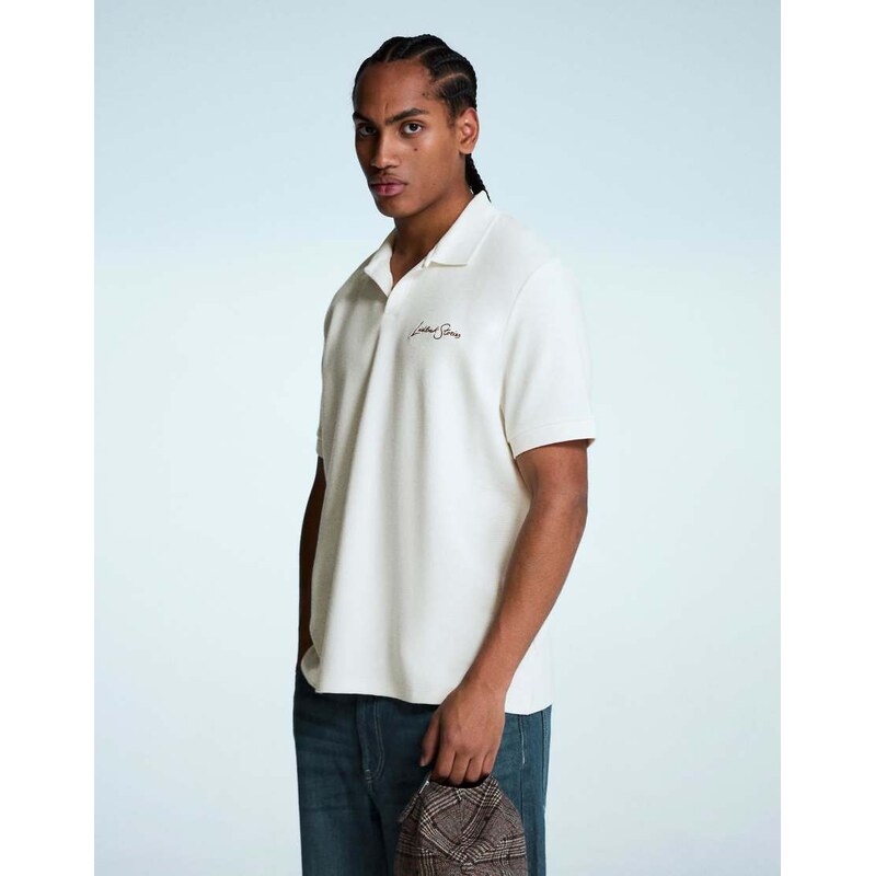 Bershka Embroidered structured short sleeve polo shirt in white