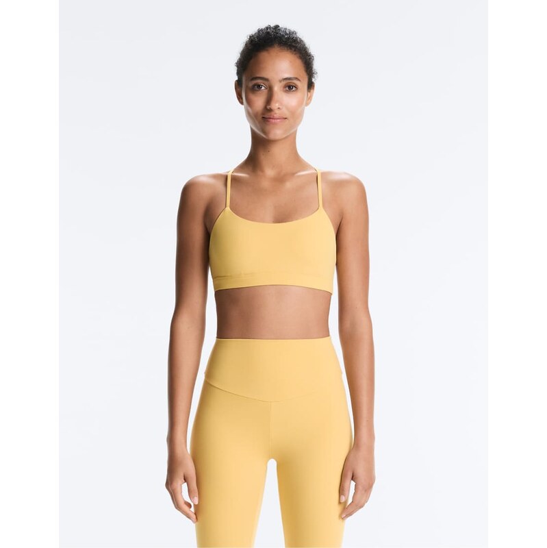 OYSHO Comfortlux light-support sports bra with crossover straps in 115011824
