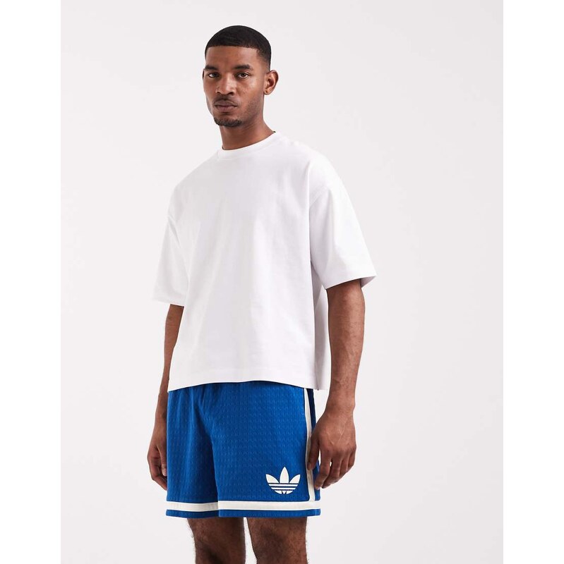 adidas Originals warp knit shorts in dark blue and white