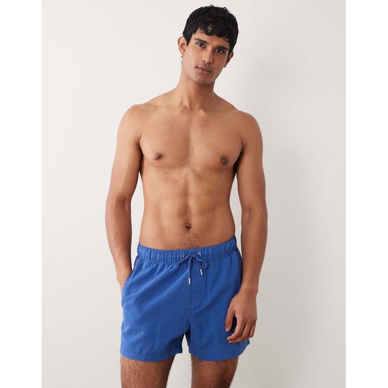 ASOS DESIGN seersucker swim shorts in short length in blue