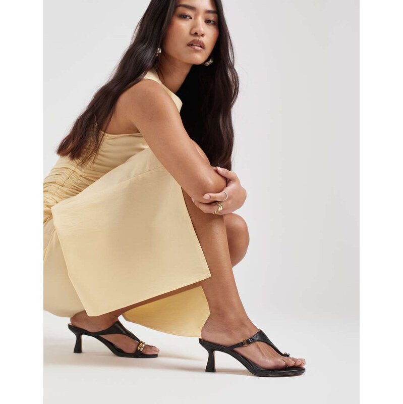 Dolce Vita Derrel mid heel sandals in black leather with gold toe loop 115079170