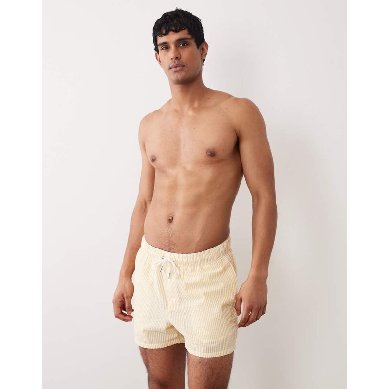 ASOS DESIGN seersucker swim shorts in short length in yellow